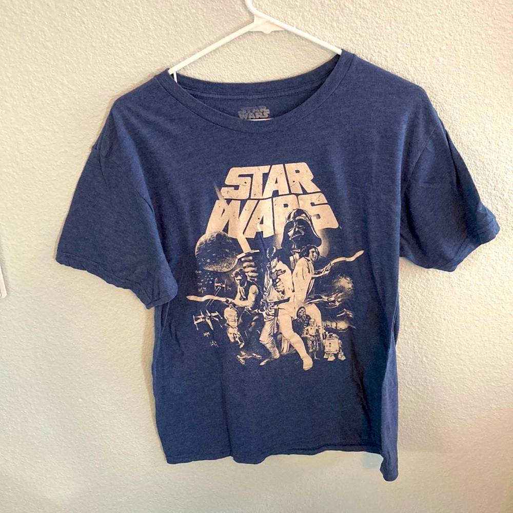 A light blue Star War’s LG kids shirt.